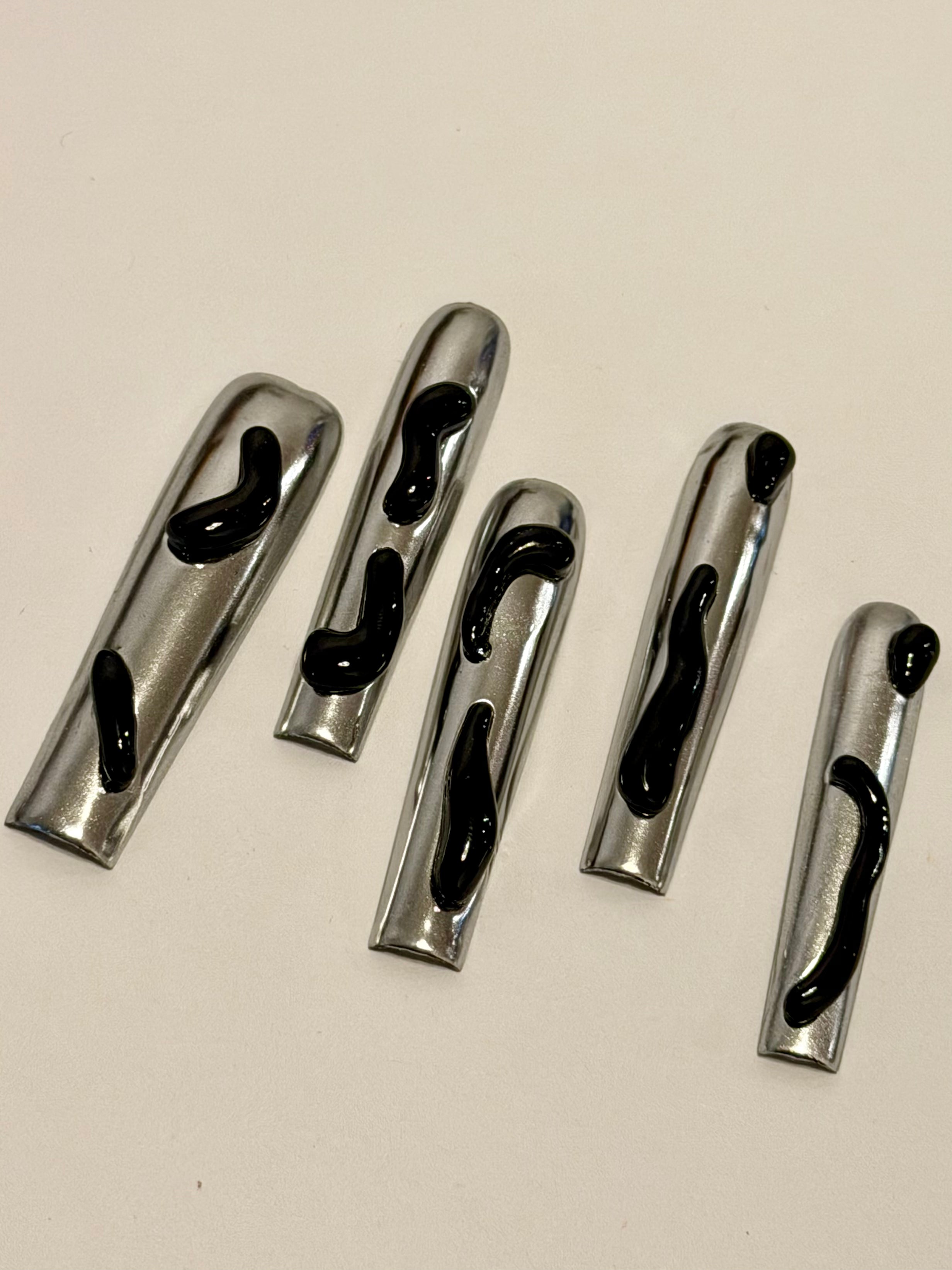 Dark Mirage – Chrome Silver Press-On Nails with Black Fluid Designs